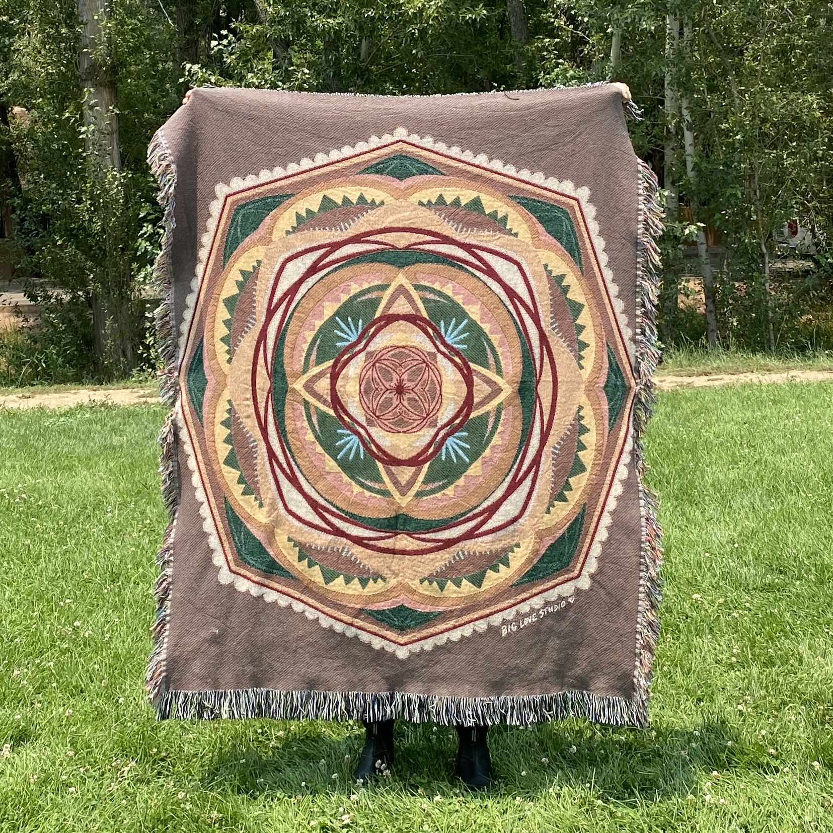 Neutral and natural colored mandala woven blanket.