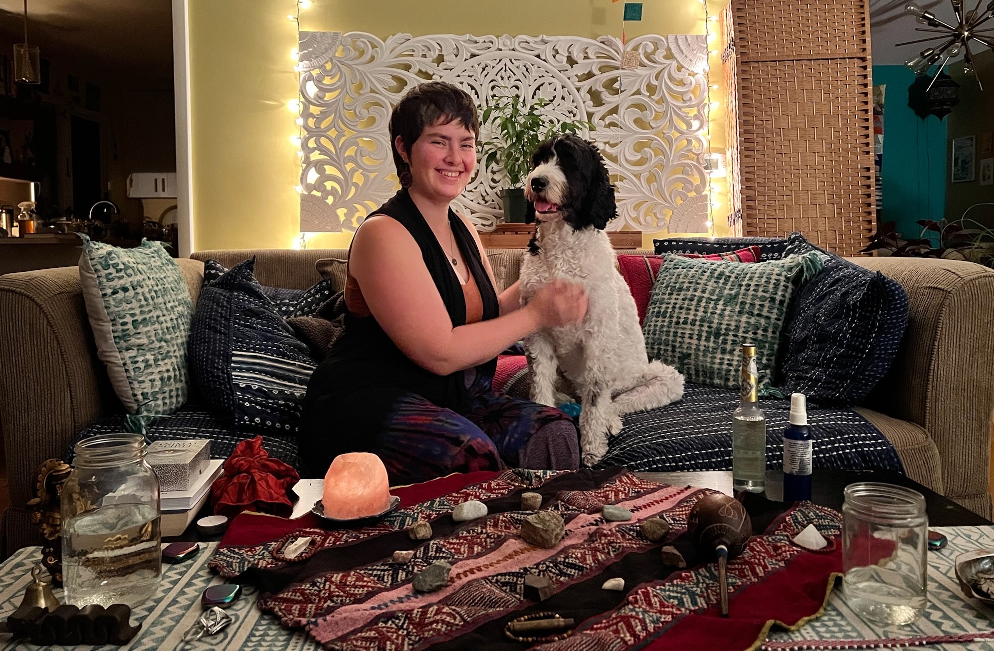 Mackenzie sits with Peaches behind an alter.